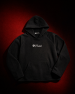 Heavyweight 500 GSM organic cotton French terry hoodie with embroidered branding, raglan sleeves, and raw hems. Slightly oversized. Made in USA.