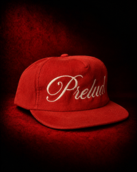 PRELUDE's red corduroy snapback hat: a textured, adjustable cap with a bold color pop and vintage feel. Shop PRELUDE hats.